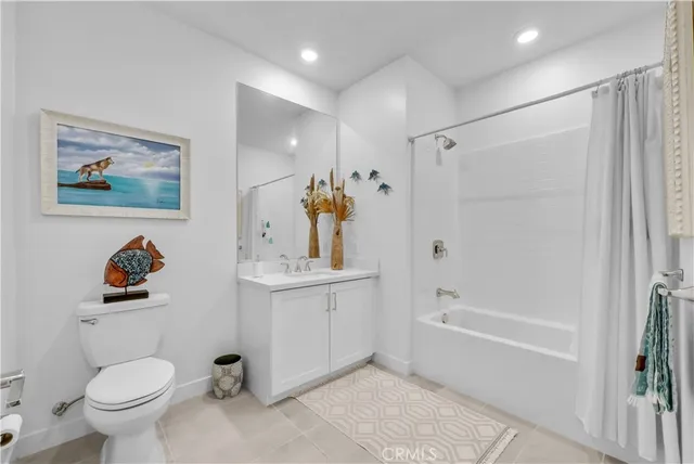 a bathroom with a toilet a sink and bathtub