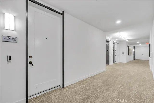 a view of a hallway with closet area