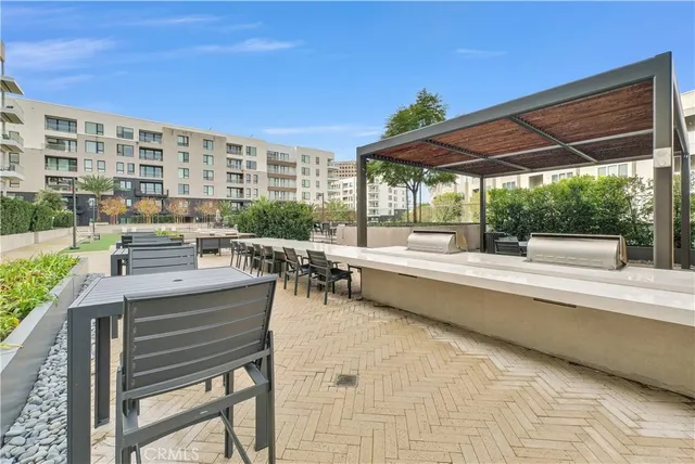 a view of swimming pool with outdoor seating
