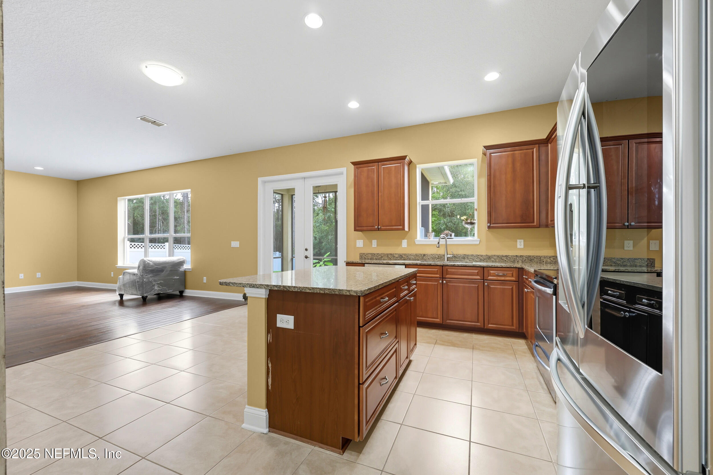 105 Castlegate Lane St. Johns, FL 32259 - Photo 11 of 45 a large kitchen with a large window and stainless steel appliances