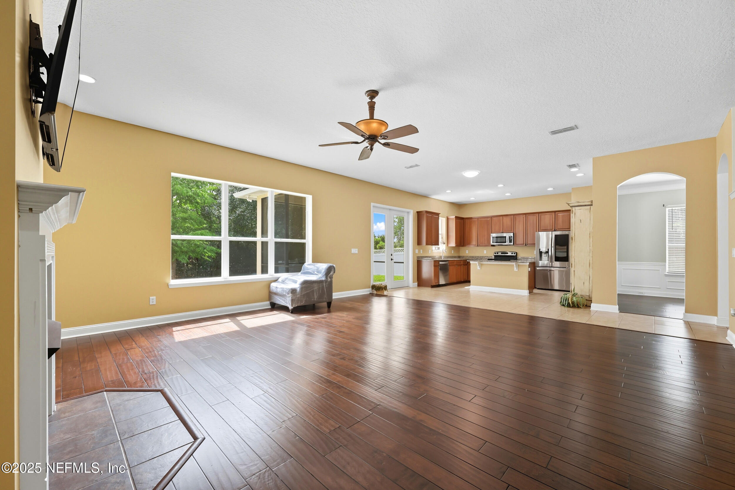 105 Castlegate Lane St. Johns, FL 32259 - Photo 17 of 45 a view of a livingroom with furniture hardwood floor and a ceiling fan