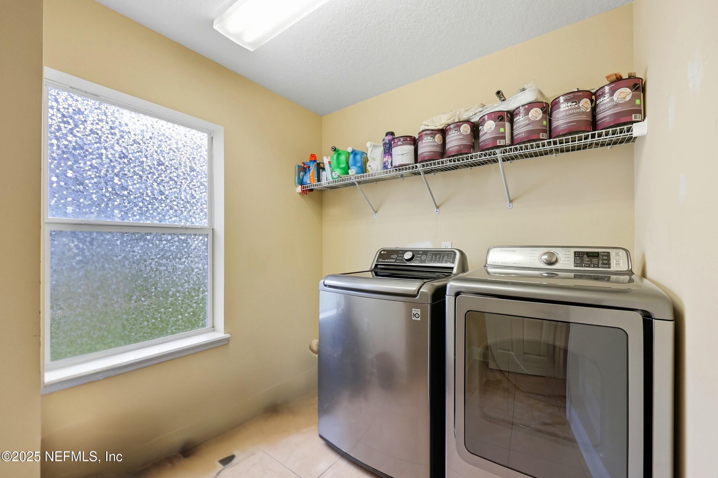 105 Castlegate Lane St. Johns, FL 32259 - Photo 20 of 45 a utility room with dryer and washer