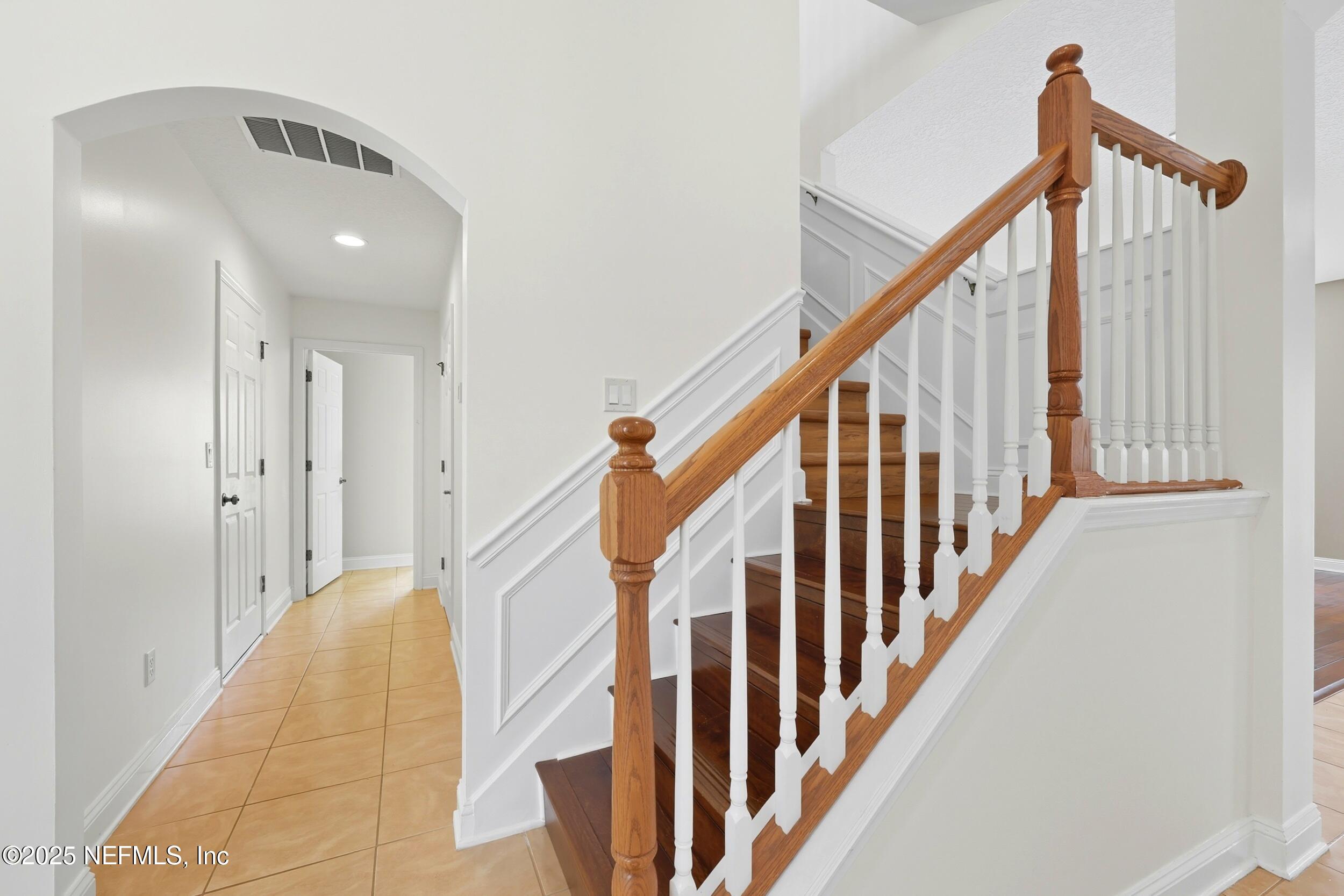 105 Castlegate Lane St. Johns, FL 32259 - Photo 21 of 45 a view of a hallway with wooden floor and staircase