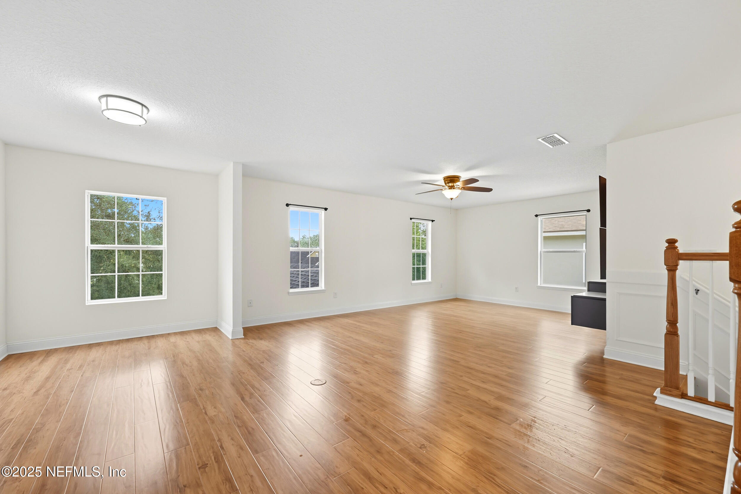 105 Castlegate Lane St. Johns, FL 32259 - Photo 25 of 45 a view of empty room with wooden floor and fan