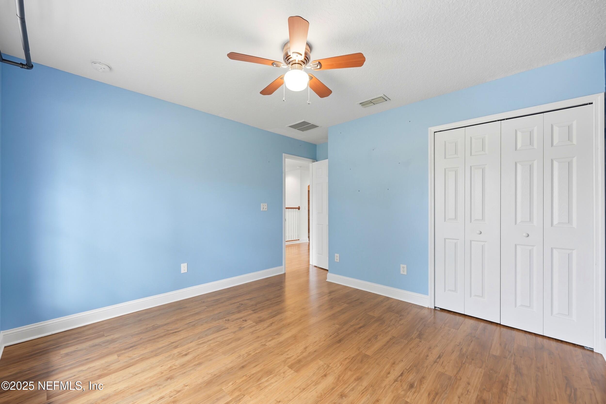 105 Castlegate Lane St. Johns, FL 32259 - Photo 30 of 45 a view of room with wooden floor and ceiling fan