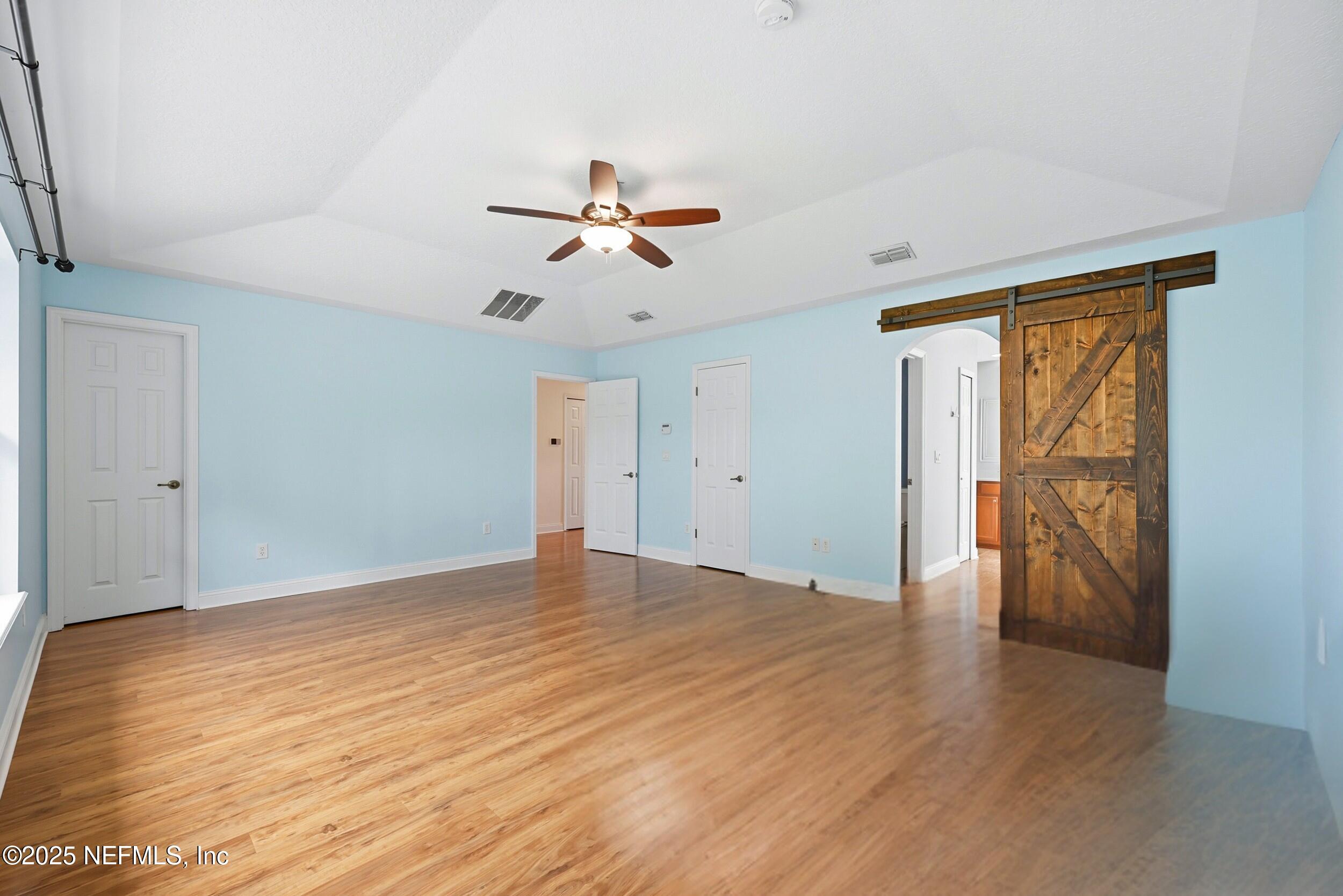 105 Castlegate Lane St. Johns, FL 32259 - Photo 33 of 45 a view of empty room with wooden floor and fan