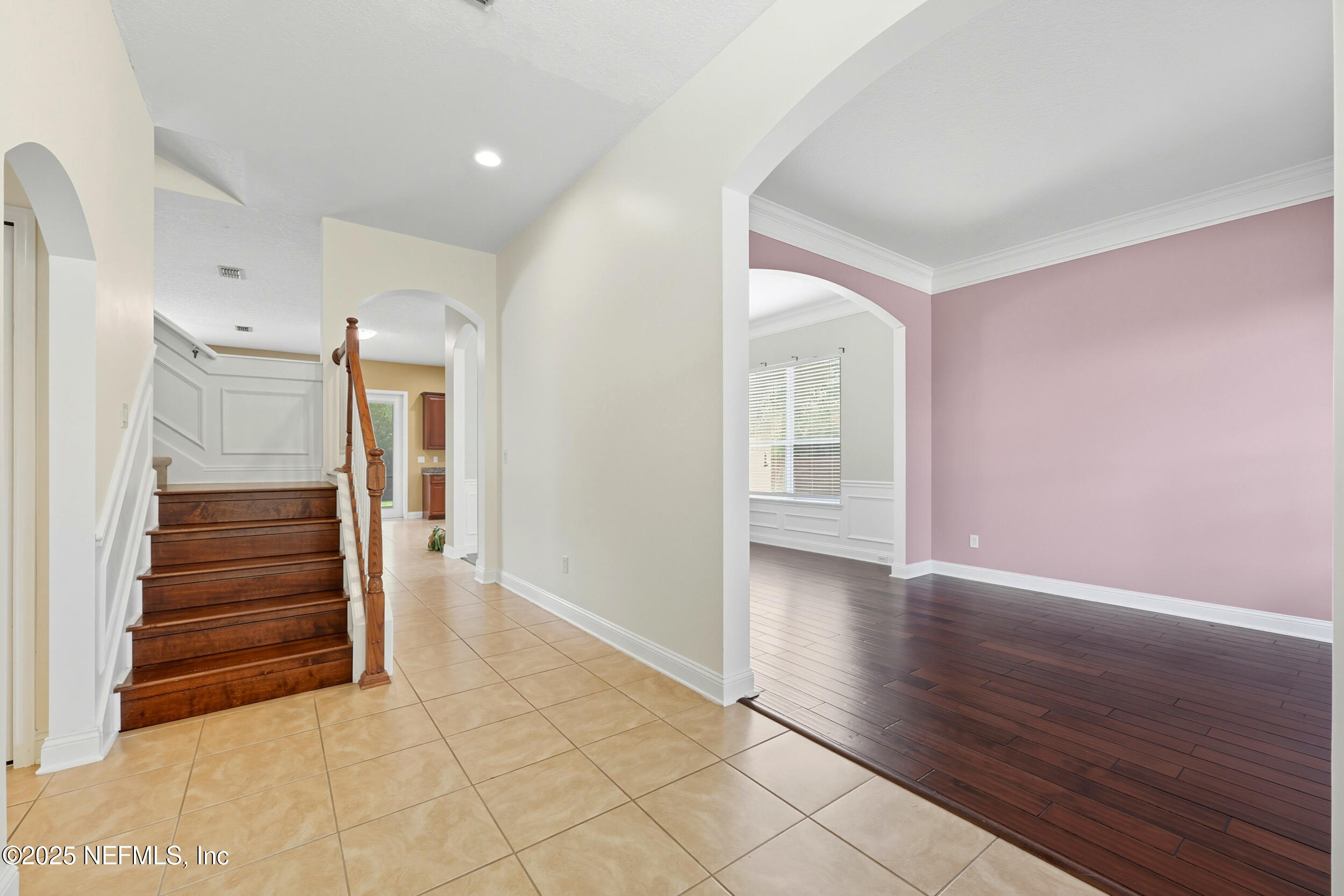 105 Castlegate Lane St. Johns, FL 32259 - Photo 4 of 45 a view of an empty room with wooden floor and a window