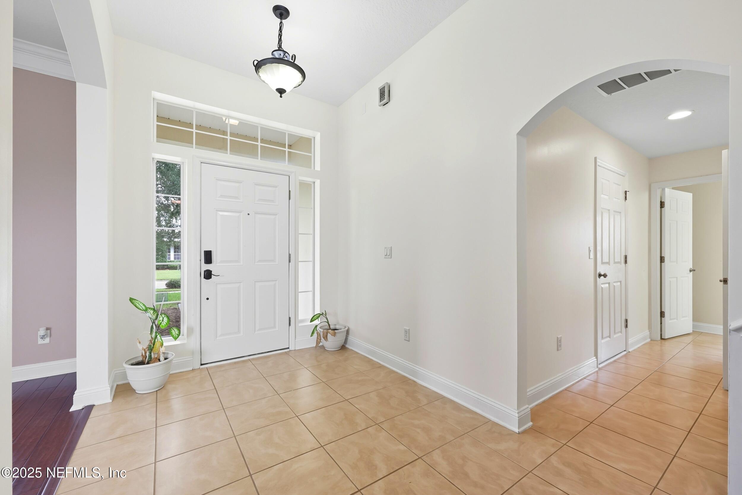 105 Castlegate Lane St. Johns, FL 32259 - Photo 5 of 45 a view of an entryway with wooden floor