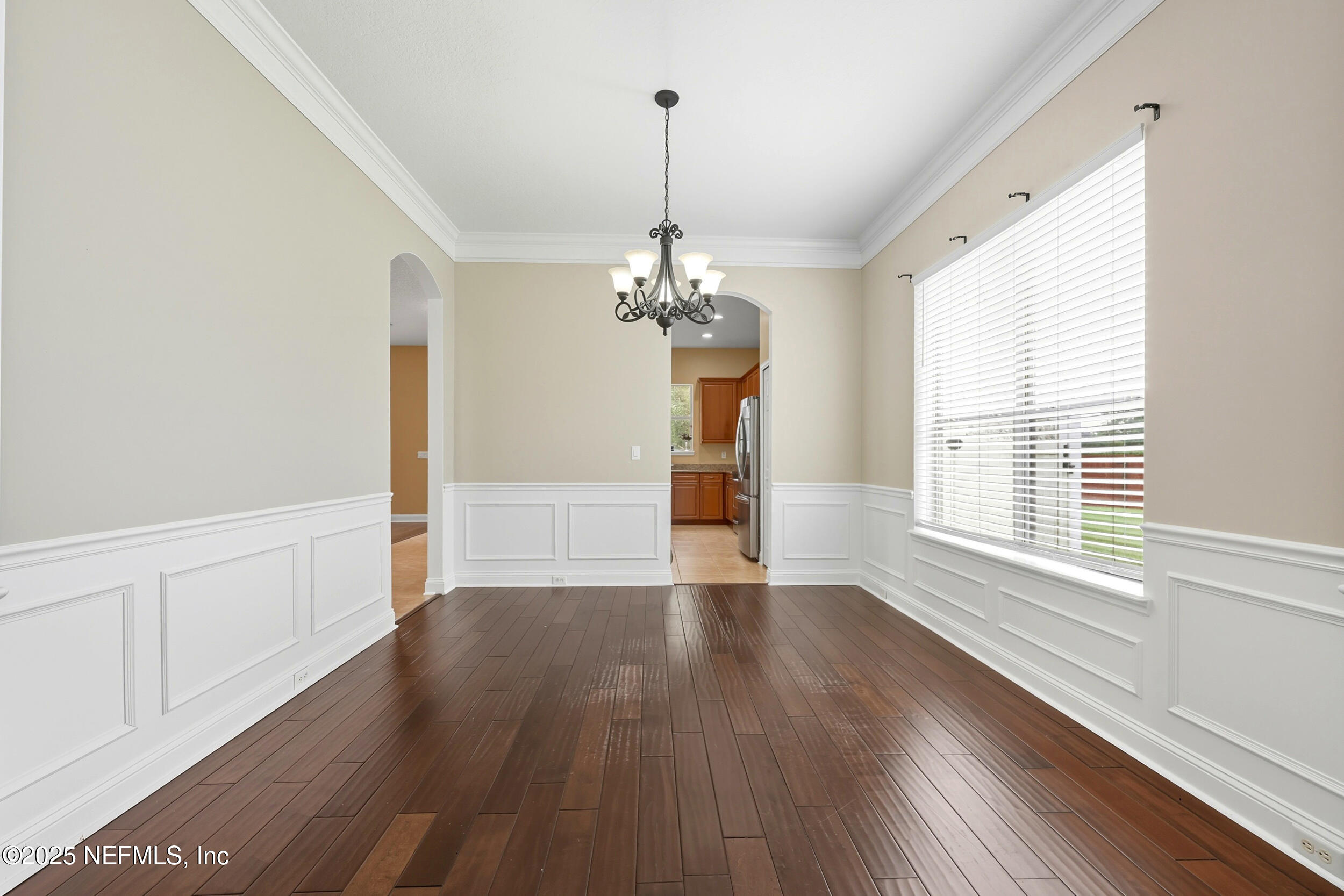 105 Castlegate Lane St. Johns, FL 32259 - Photo 8 of 45 a view of a room with wooden floor chandelier and windows