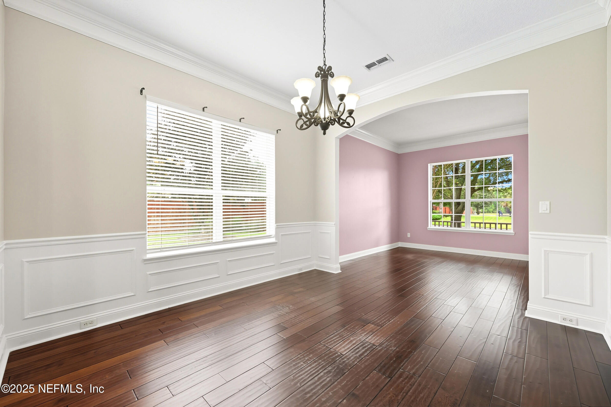 105 Castlegate Lane St. Johns, FL 32259 - Photo 9 of 45 a view of an empty room with wooden floor and a window