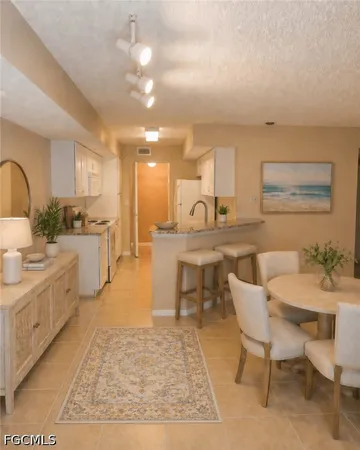 a large kitchen with a table and chairs