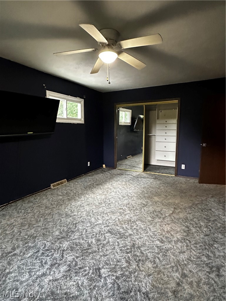 198 Park Road Painesville, OH 44077 - Photo 24 of 31 Room featuring dark-toned walls and patterned carpet flooring