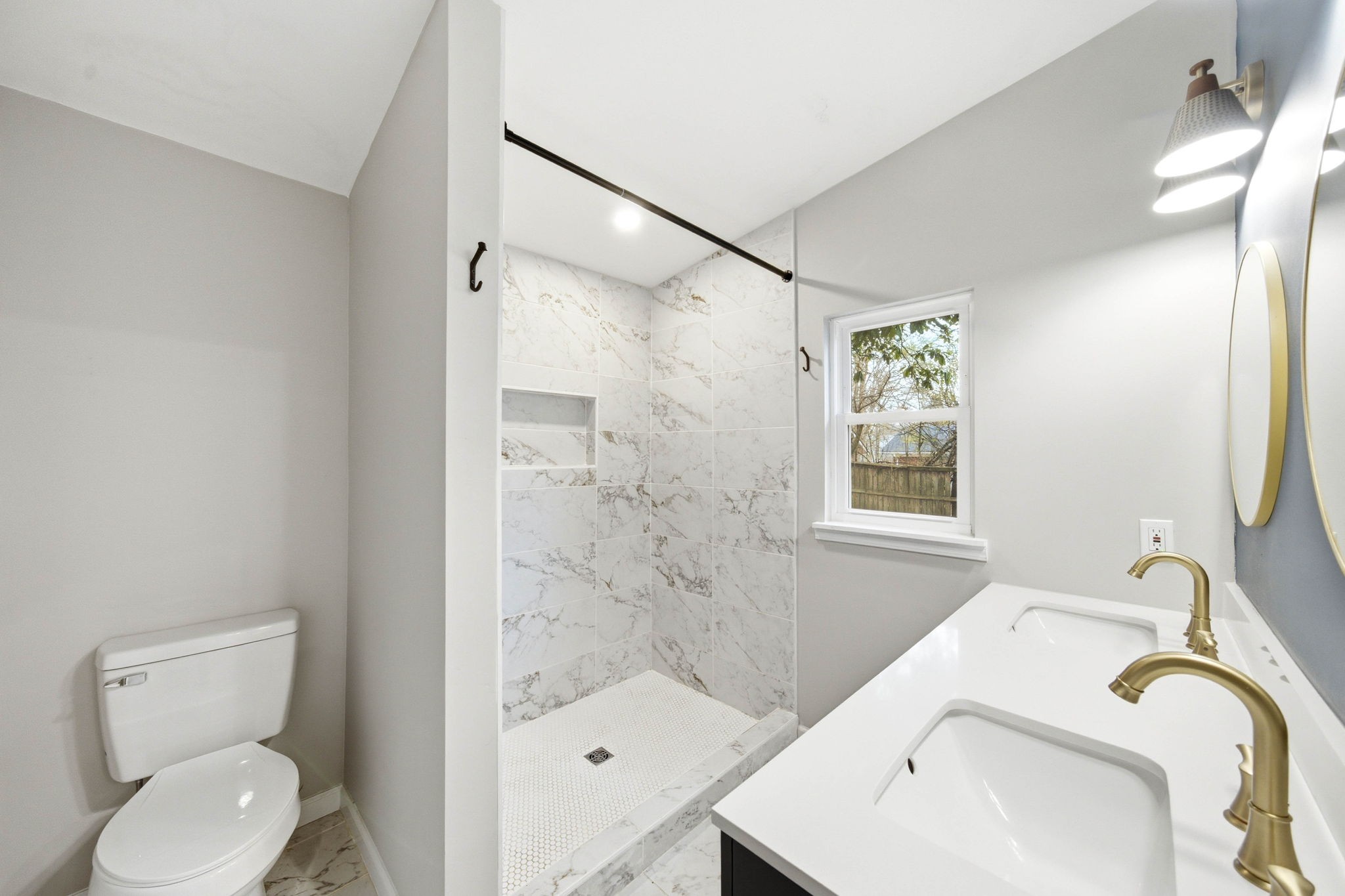 504 North Washington Street Tullahoma, TN 37388 - Photo 14 of 41 a bathroom with a sink toilet and shower