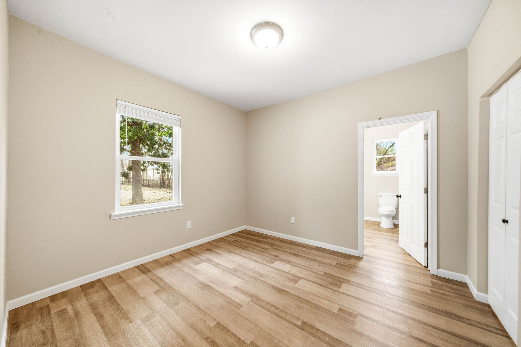 504 North Washington Street Tullahoma, TN 37388 - Photo 22 of 41 a view of an empty room with wooden floor and a window