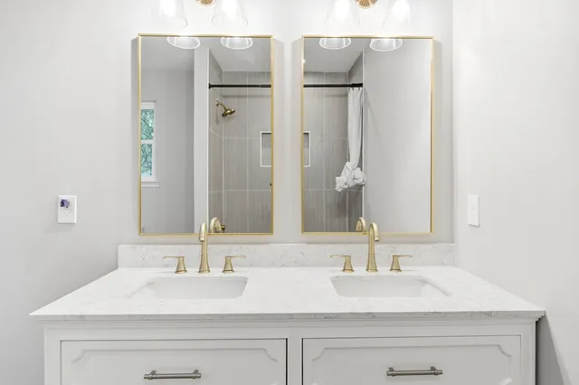 a bathroom with a sink and a mirror