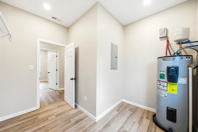 a view of hallway with wooden floor