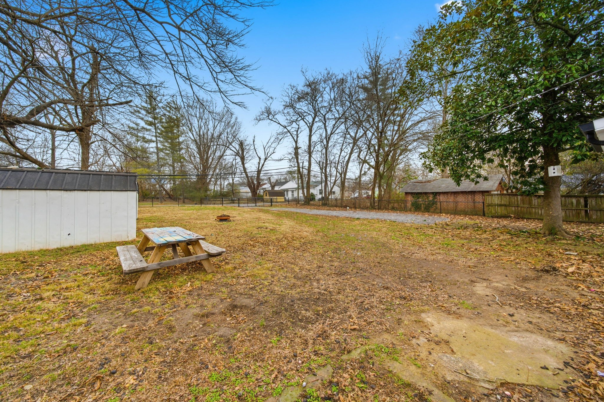504 North Washington Street Tullahoma, TN 37388 - Photo 32 of 41 a view of a lake with a bench and trees around