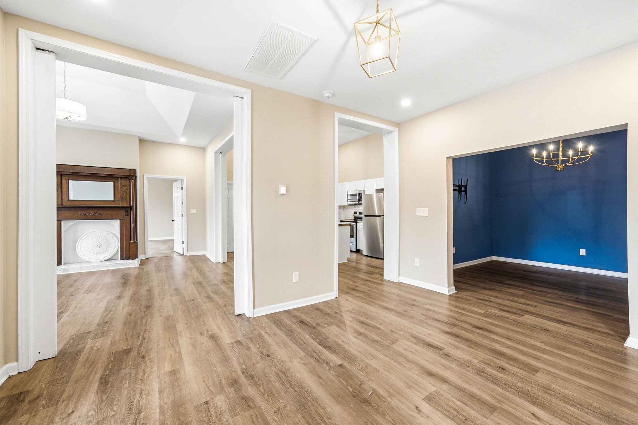 504 North Washington Street Tullahoma, TN 37388 - Photo 6 of 41 a view of an empty room with wooden floor and a window