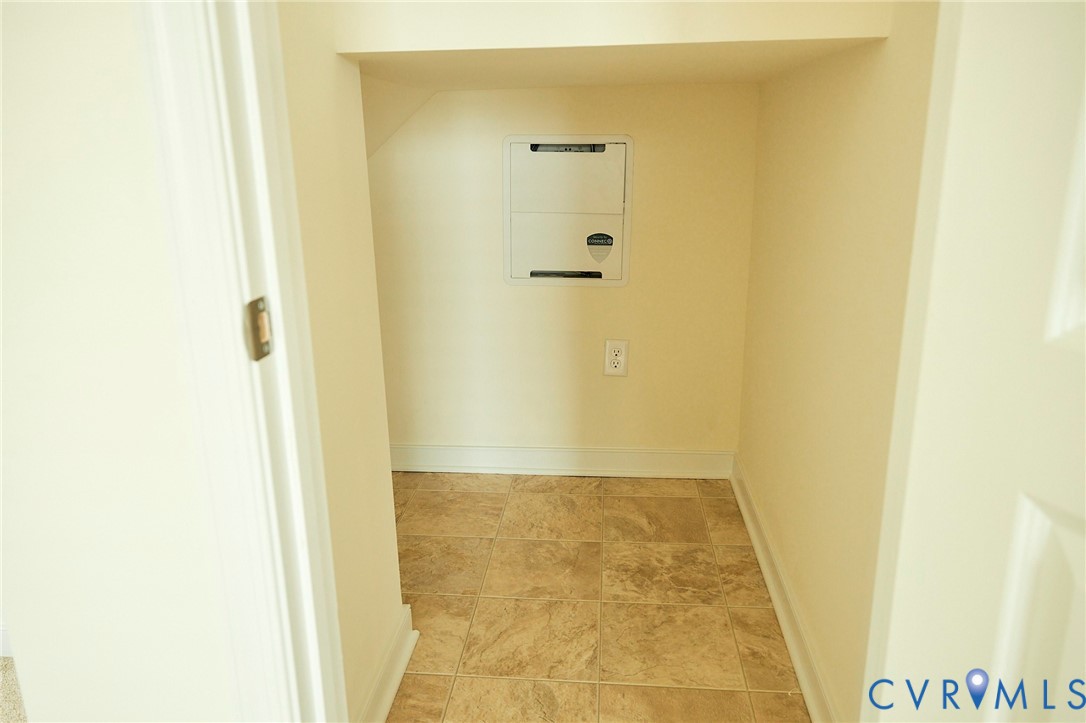 214 Greenpark Road Sandston, VA 23150 - Photo 16 of 50 Hallway featuring baseboards and light tile patter