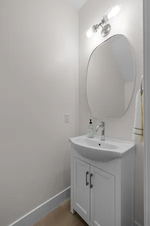 a bathroom with a sink and vanity