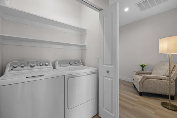 a utility room with dryer and washer