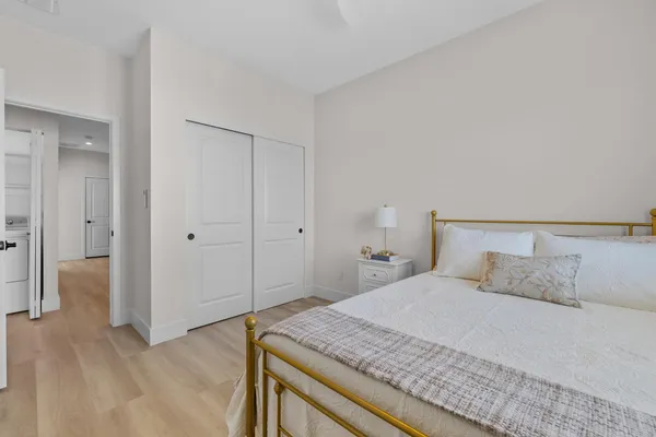 a bedroom with a bed and closet