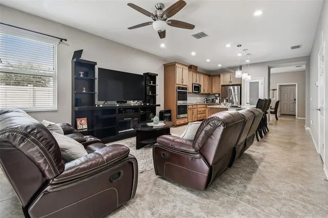 a bed room with a bed and chandelier