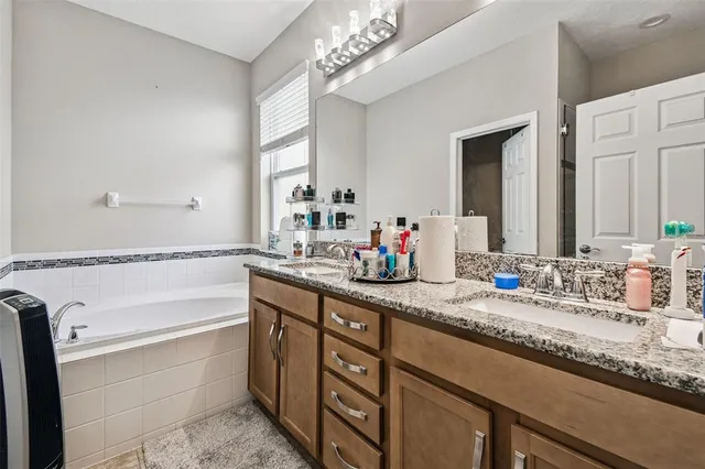 a bathroom with a glass shower door