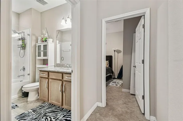 a bathroom with a shower and a bath tub