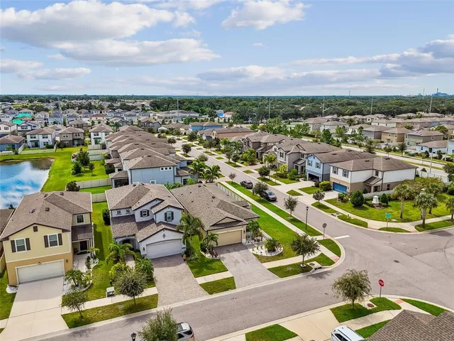 an aerial view of a house with a ocean view