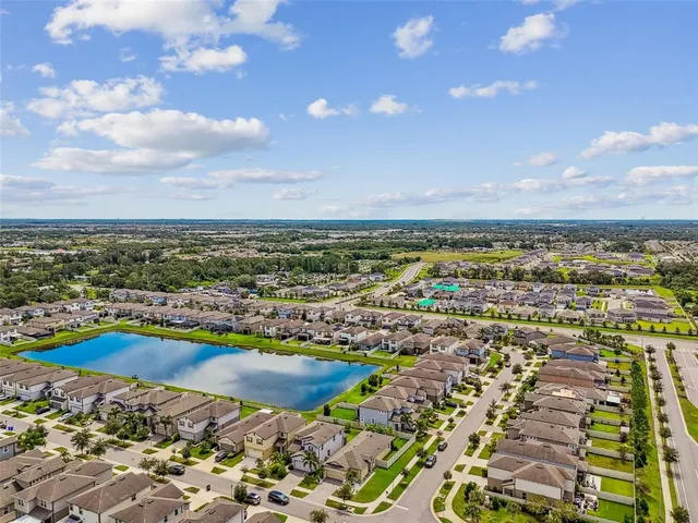 an aerial view of residential building with parking space