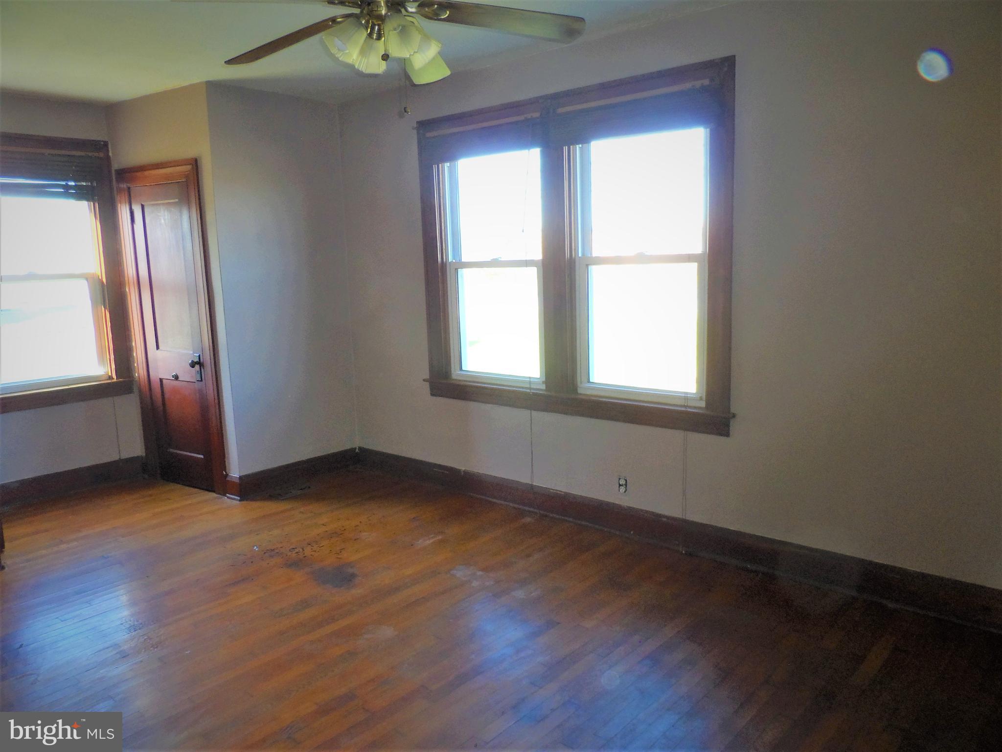 2211 Sparrows Point Road Baltimore, MD 21219 - Photo 21 of 28 an empty room with wooden floor and windows
