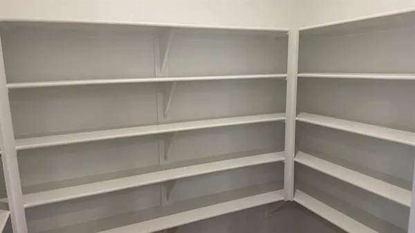 a view of an empty walk in closet