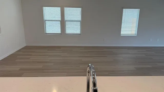 a kitchen with a refrigerator stove and sink