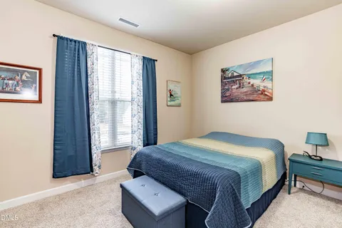 a bathroom with a tub a sink and a mirror