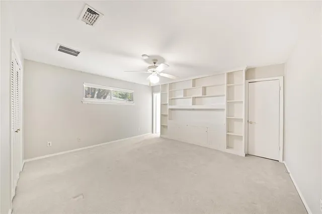 a view of a kitchen with a sink and a refrigerator