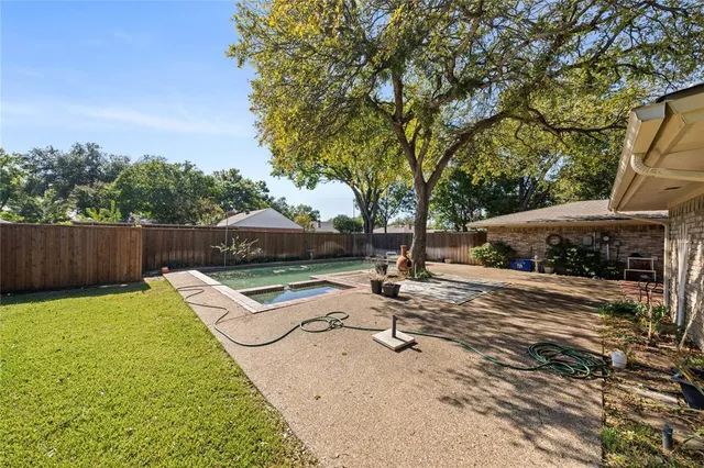 a view of a backyard with a patio