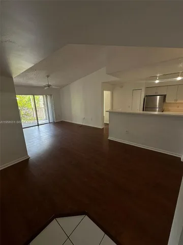 an empty room with wooden floor