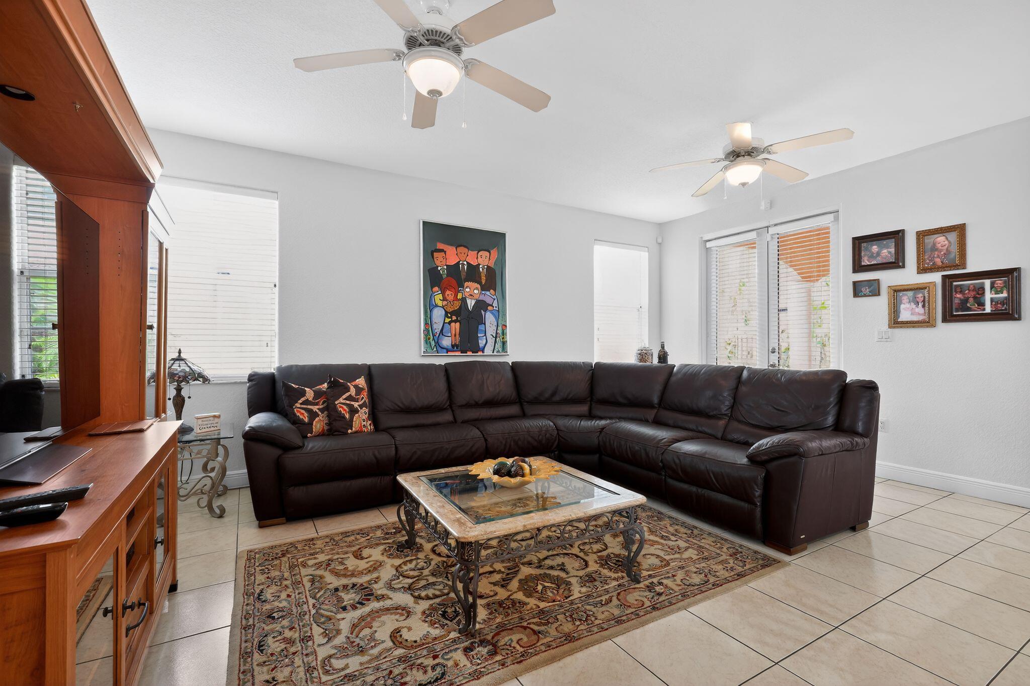 16613 Northwest 77th Path Miami Lakes, FL 33016 - Photo 11 of 41 a living room with furniture and a flat screen tv