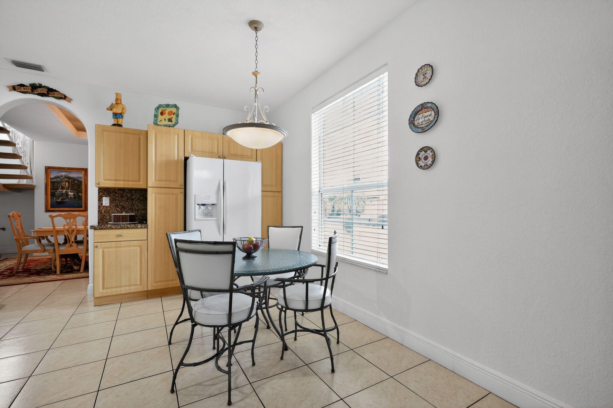 16613 Northwest 77th Path Miami Lakes, FL 33016 - Photo 18 of 41 a dining room with furniture and window