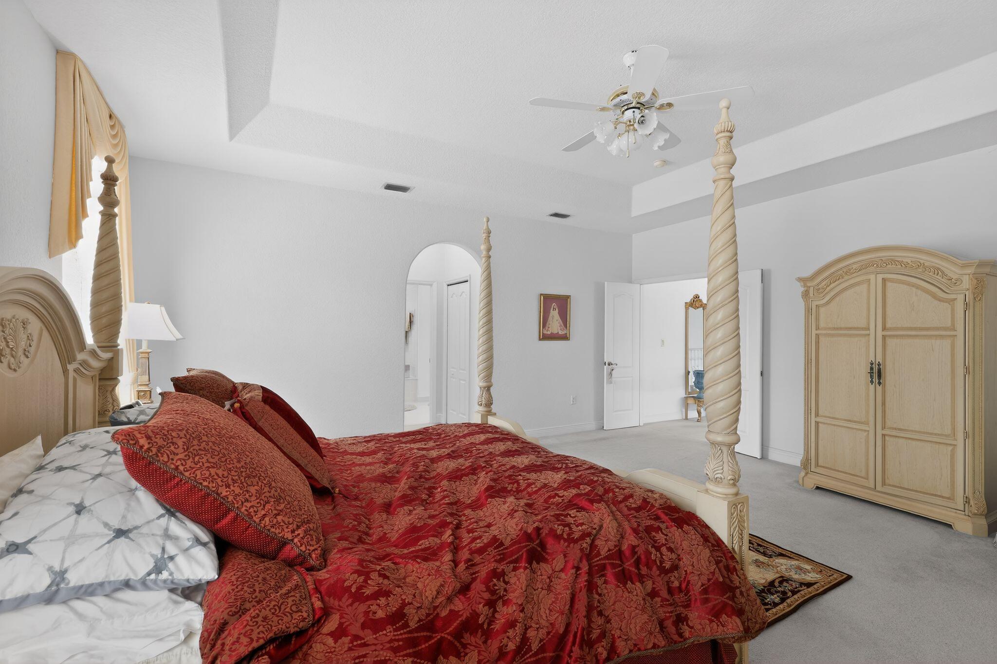 16613 Northwest 77th Path Miami Lakes, FL 33016 - Photo 22 of 41 a bedroom with a bed and a mirror