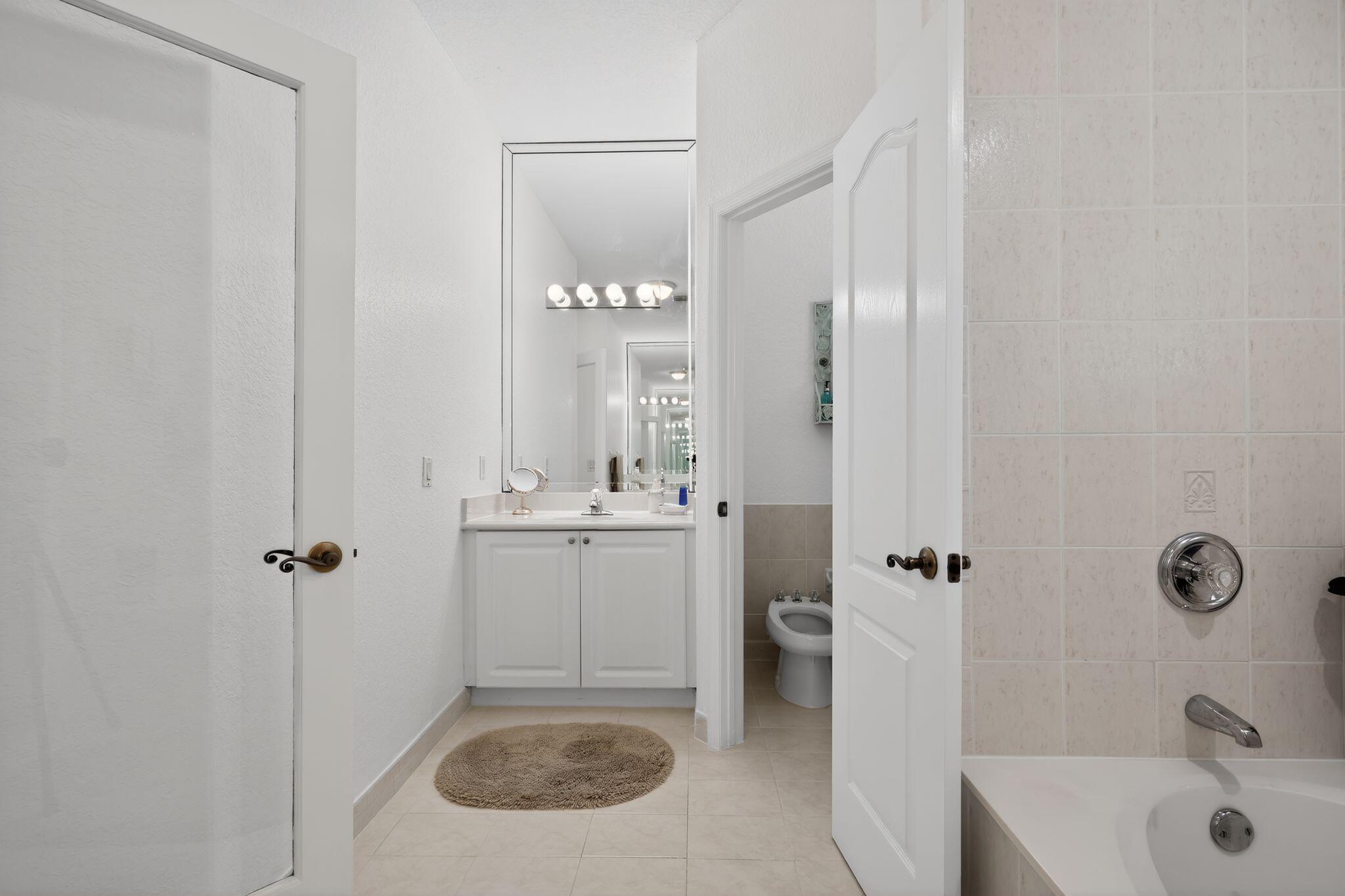 16613 Northwest 77th Path Miami Lakes, FL 33016 - Photo 23 of 41 a bathroom with a sink a toilet and shower