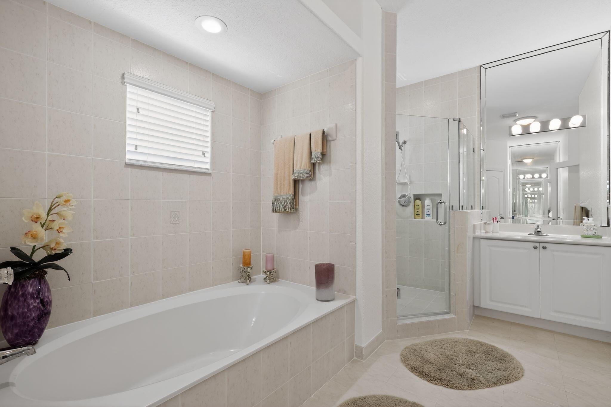 16613 Northwest 77th Path Miami Lakes, FL 33016 - Photo 24 of 41 a bathroom with a tub a sink and a shower