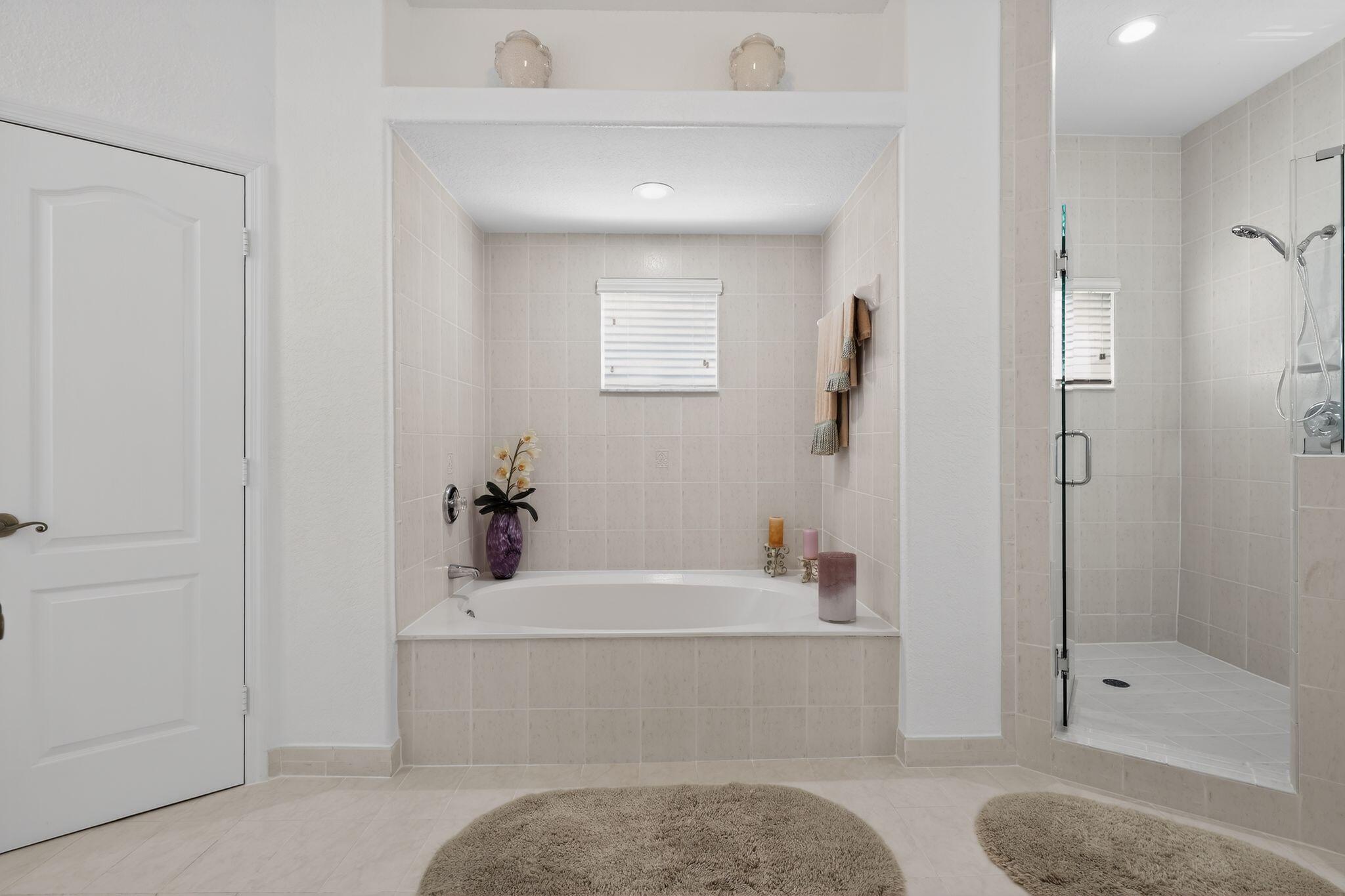 16613 Northwest 77th Path Miami Lakes, FL 33016 - Photo 28 of 41 a bathroom with a tub shower sink and mirror