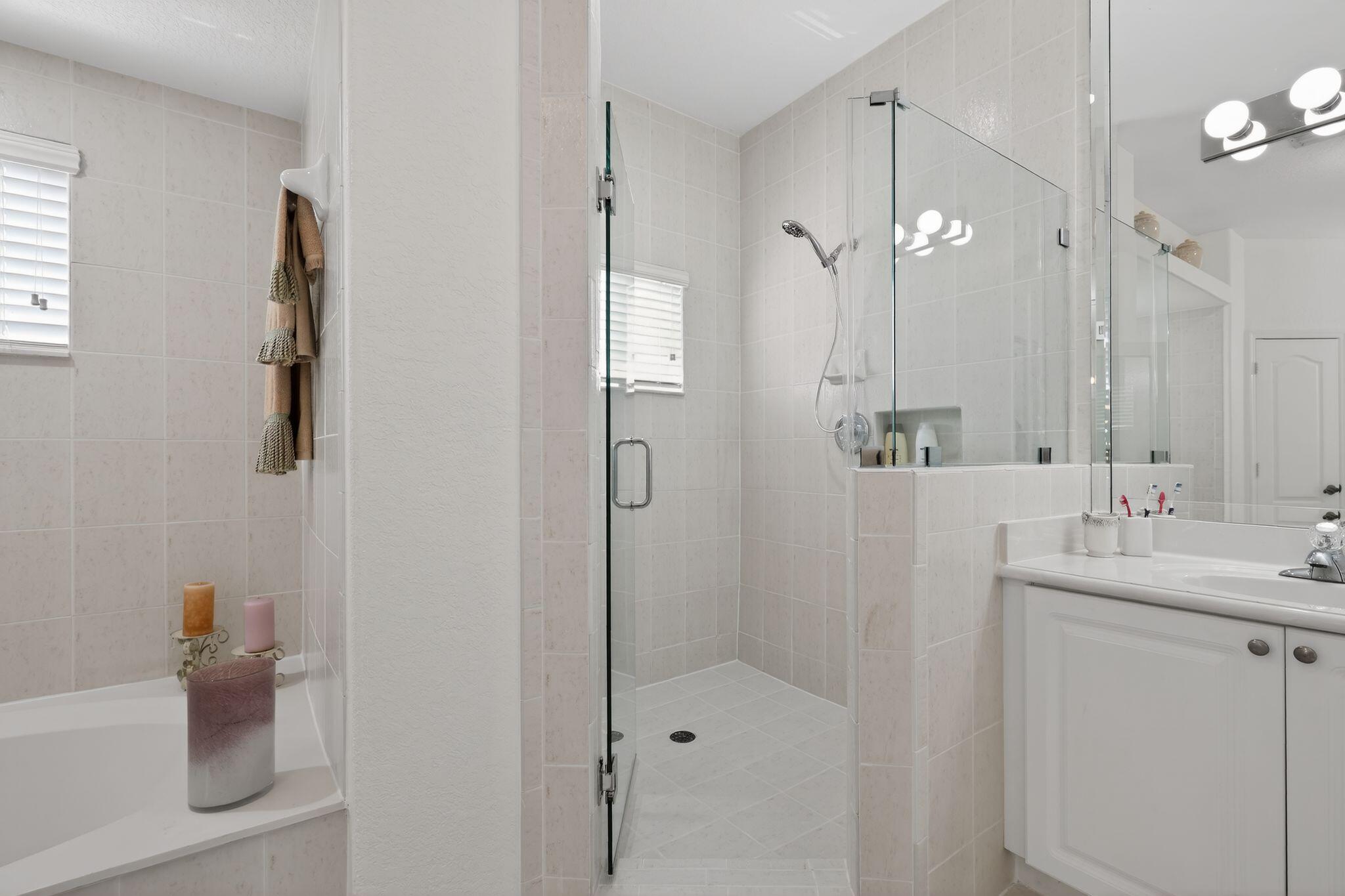 16613 Northwest 77th Path Miami Lakes, FL 33016 - Photo 29 of 41 a bathroom with a shower sink and mirror