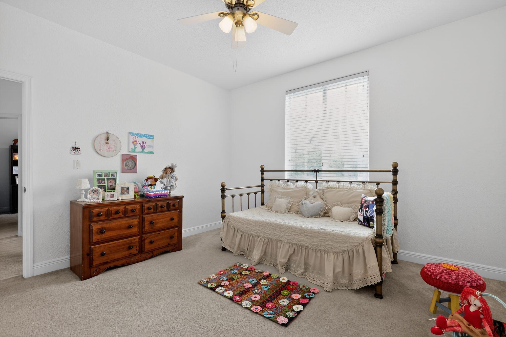 16613 Northwest 77th Path Miami Lakes, FL 33016 - Photo 31 of 41 a bedroom with a bed and a chandelier