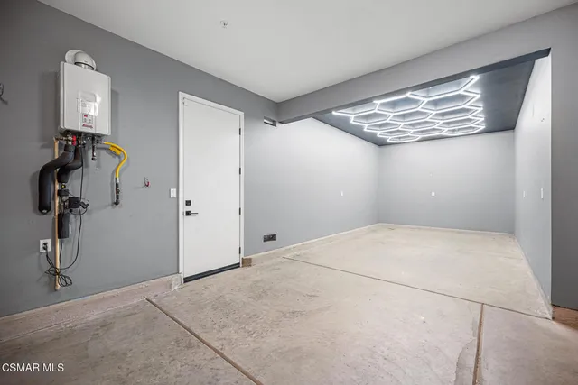 a bathroom with a bathtub shower sink vanity mirror and toilet