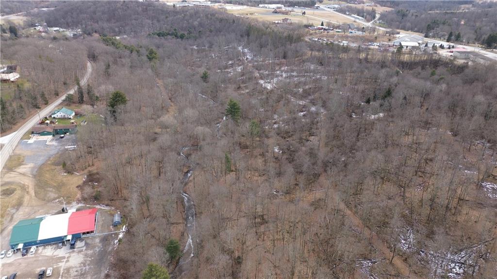2685 Walston Road Punxsutawney, PA 15767 - Photo 25 of 28 a backyard of a house with lots of green space and fog