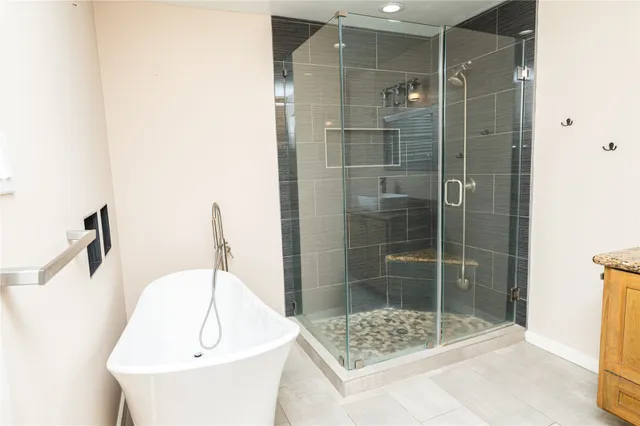 a bathroom with a shower and a sink