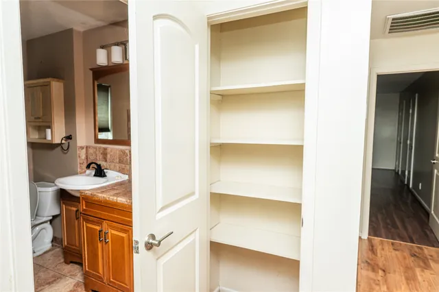 a bathroom with a sink a mirror and a shower